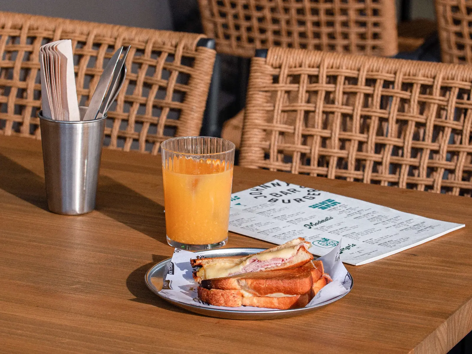 Toasted ham and cheese sandwich and orange juice on Johnny's Bar terrace