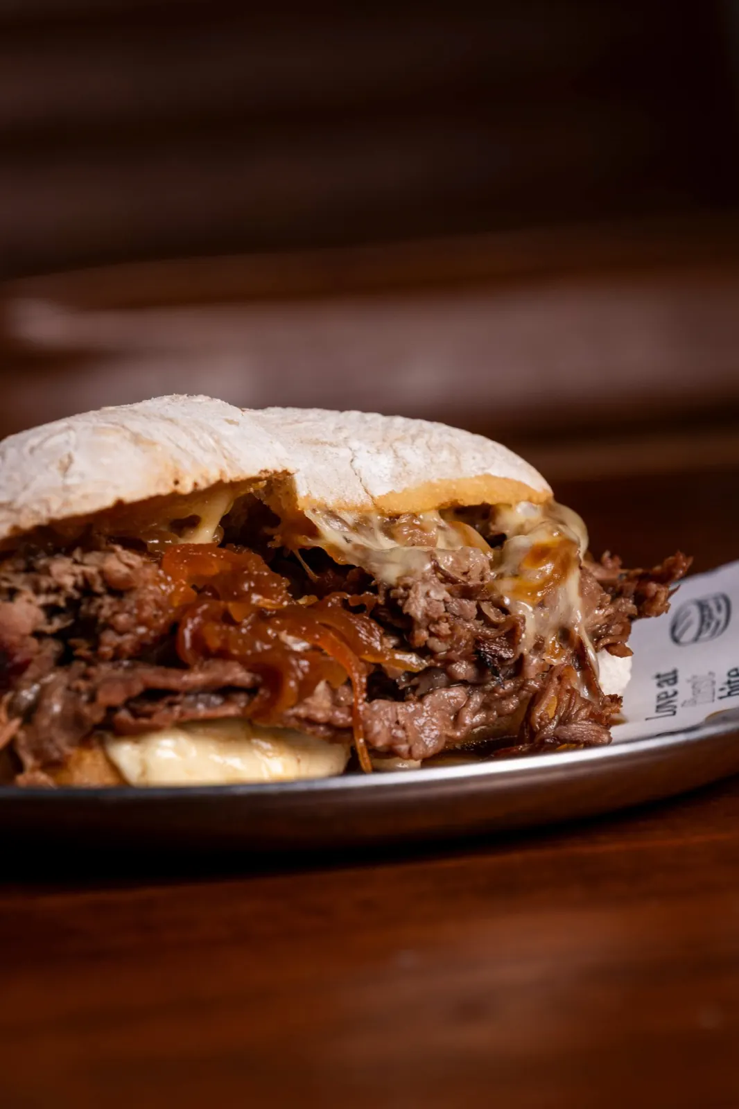 Pulled beef sandwich with caramelised onion and cheese